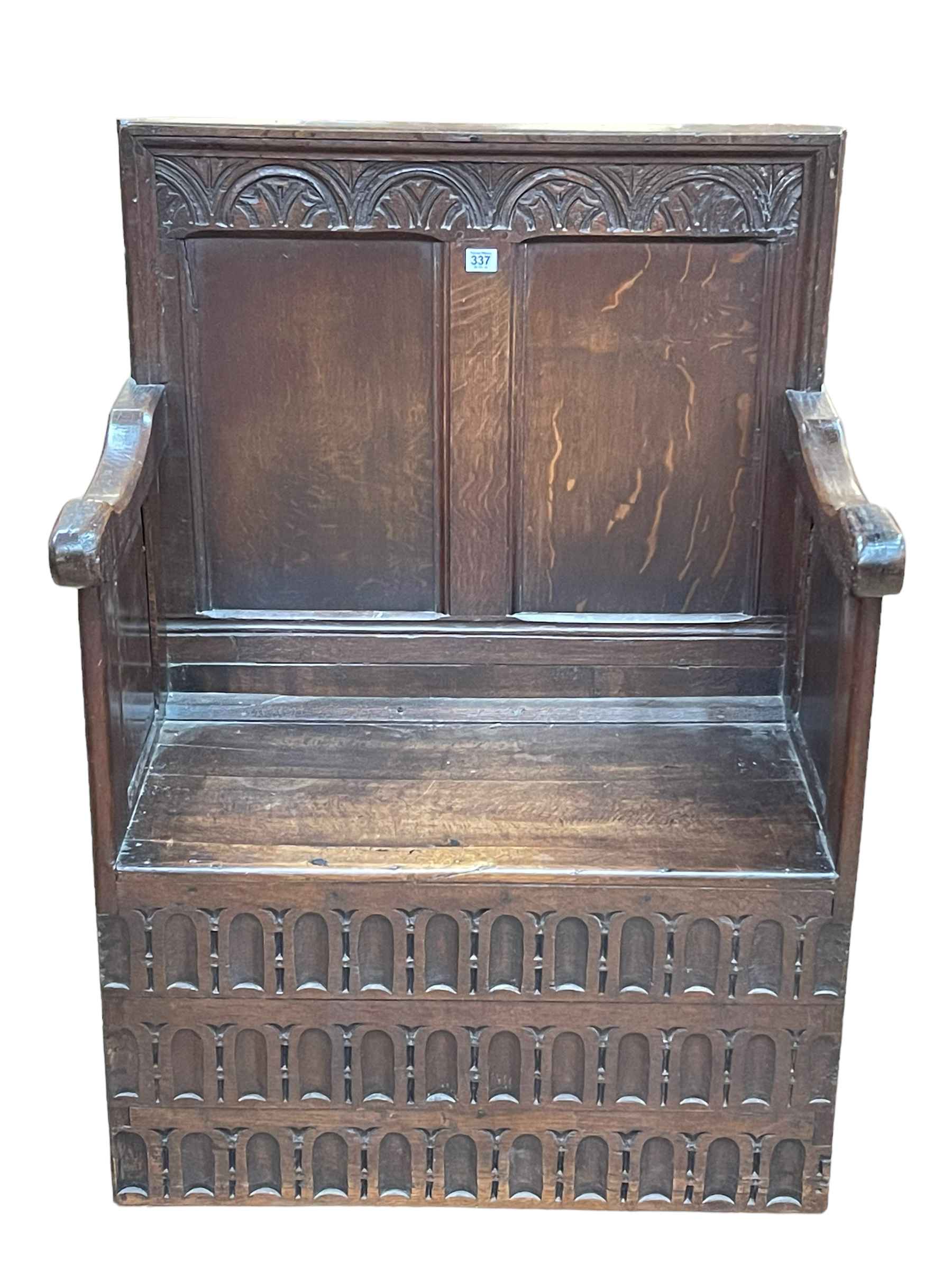 Antique carved oak double panel back hall seat, 105cm by 76cm by 49cm.