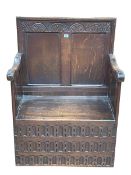 Antique carved oak double panel back hall seat, 105cm by 76cm by 49cm.