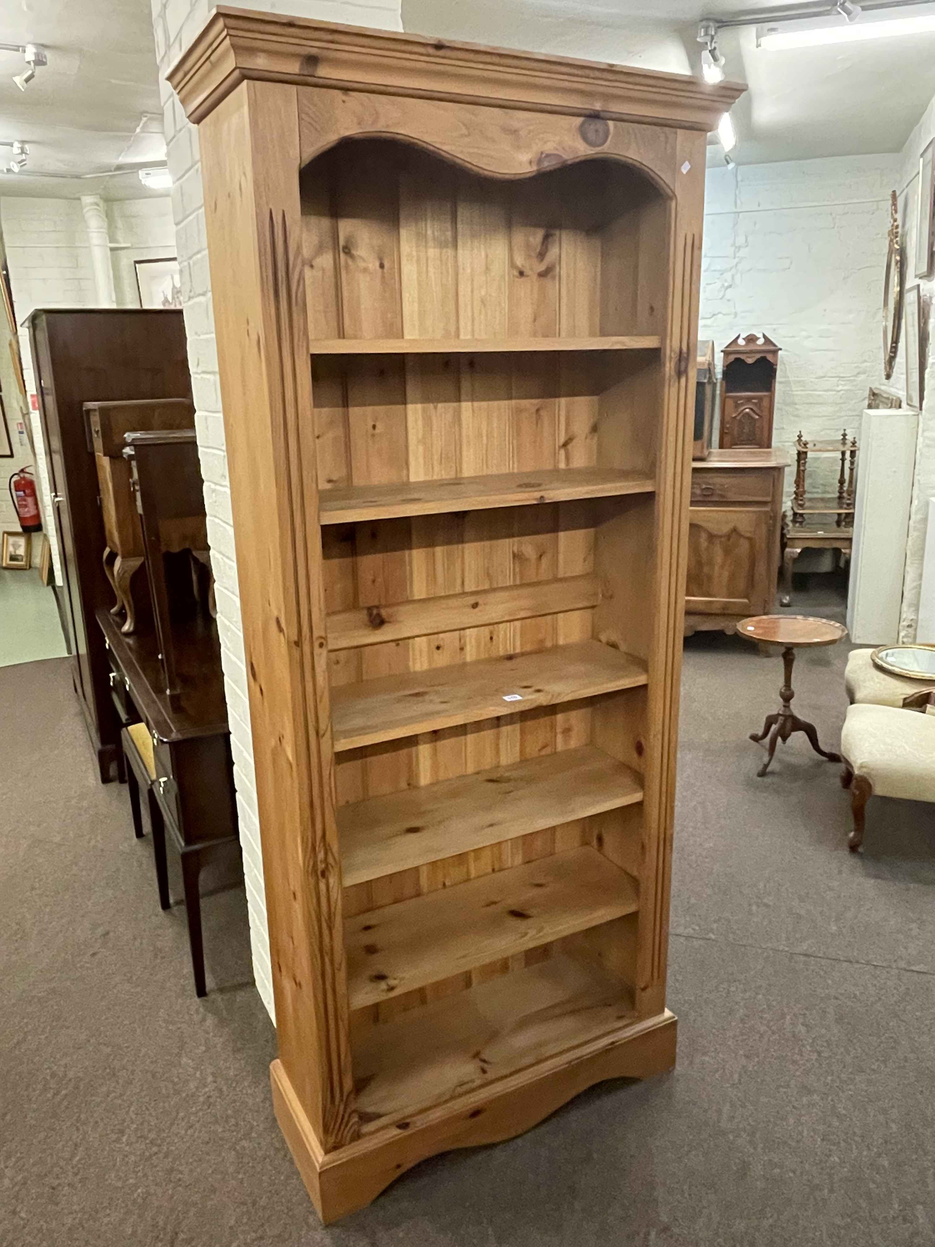 Pine open bookcase with five adjustable shelves, 198cm by 89cm by 33cm.