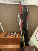 Collection of fishing rods and five reels.