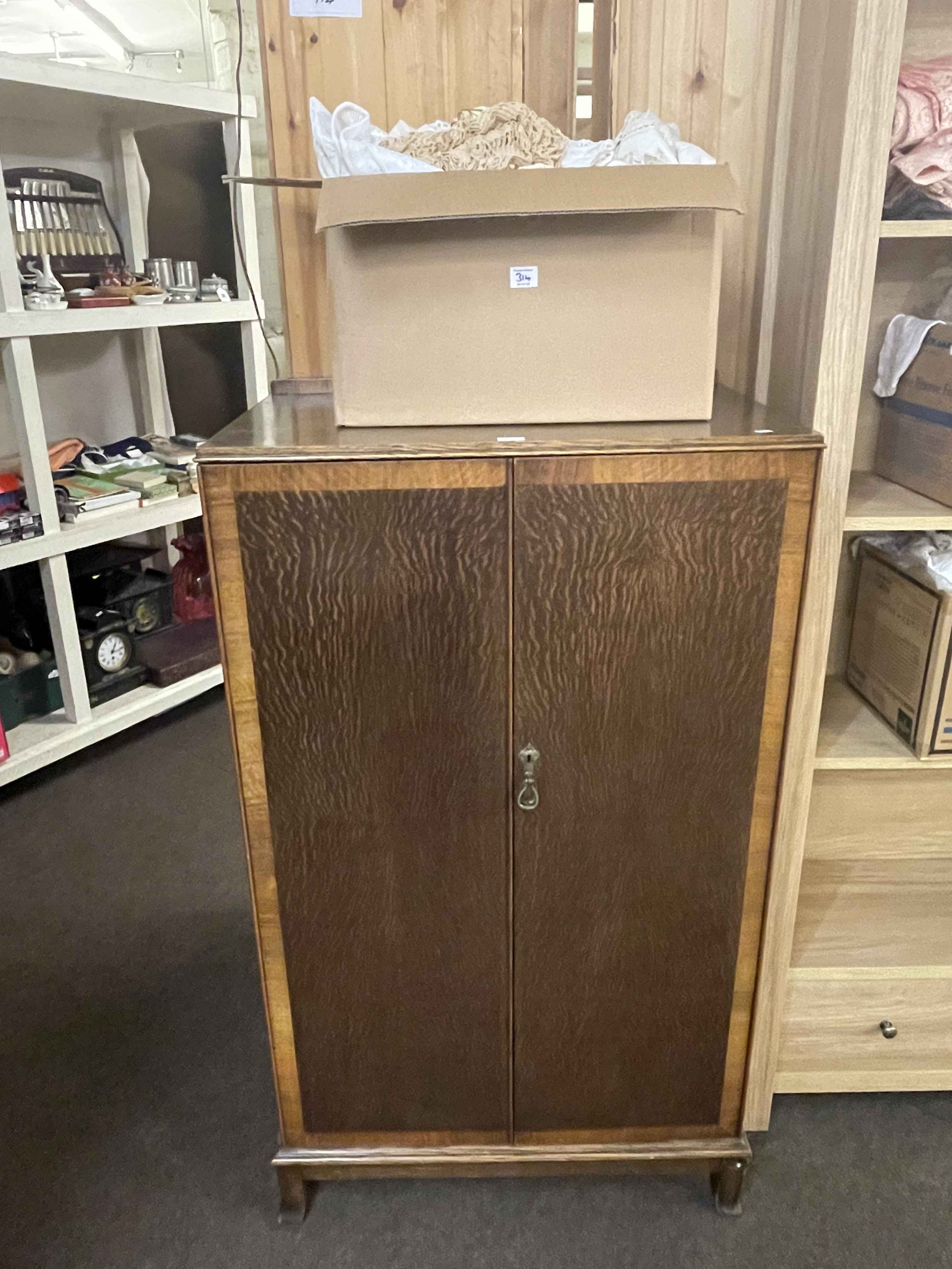 Early 20th Century oak two door linen cupboard and three boxes of linen.