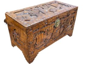 Oriental carved camphorwood trunk, 59cm by 104cm by 52cm.