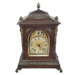 Oak and brass mounted mantel clock with brass and silvered dial, 42cm.