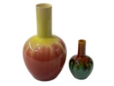 Two Linthorpe Pottery bottle vases, larger one yellow to red glazed, shape number 1691, 23.