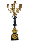 Gilt and ebonised metal ornate six branch candelabra in the form of winged angel supporting candle