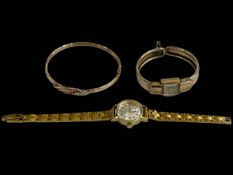 Ruby and diamond set 9 carat gold bangle, together with Gruen and Tissot wristwatches (3).