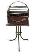 Edwardian mahogany and brass revolving magazine rack on triform base, 87cm by 38cm by 23cm.