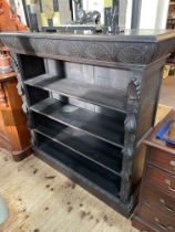 Victorian carved dark oak four tier open bookcase, 123cm by 38cm.