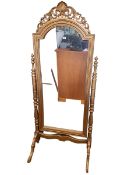 Gilt painted cheval mirror with turned supports, 193cm by 80cm.