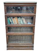 Oak Globe Wernicke four height stacking bookcase with leaded glass doors and base drawer, 146.