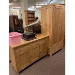 Contemporary oak finish two door wardrobe with base drawer and similar three door side cabinet.