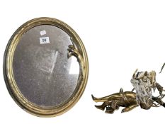 Art Nouveau style brass mirror and a cupid ceiling light.