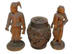 Pair of carved wood Oriental figures and carved wood tobacco jar.