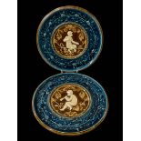 Pair Austrian pottery cherub plates, 30cm diameter.