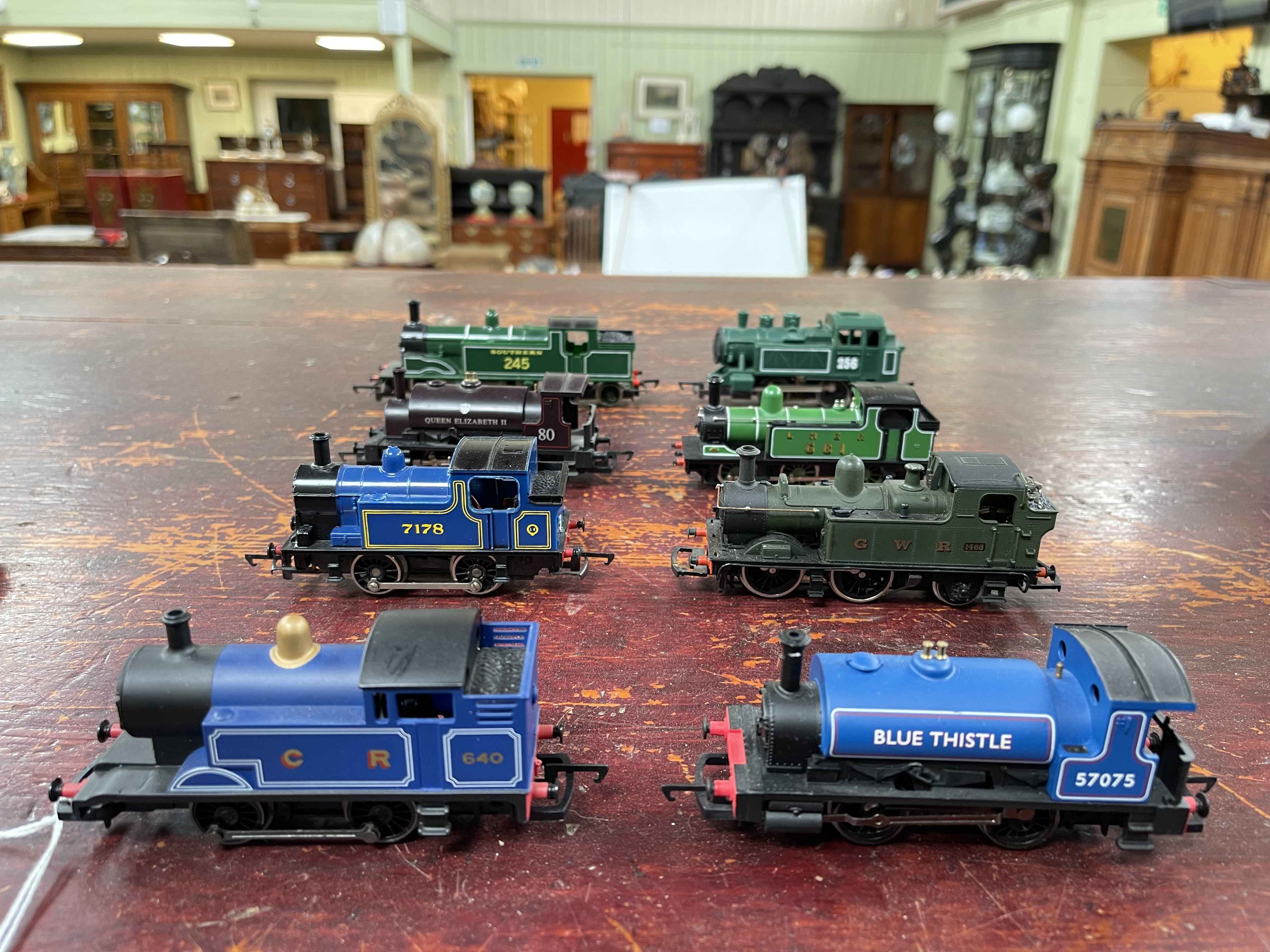 Eight model steam locomotives.