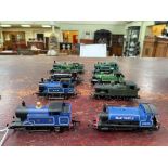 Eight model steam locomotives.