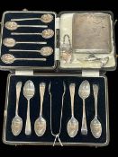Two cased sets of silver tea and coffee spoons, cigarette case, decanter label and shoe (5).