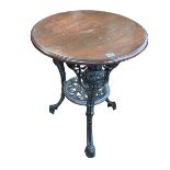 Circular cast base pub table, 69cm by 58cm diameter.