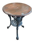 Circular cast base pub table, 69cm by 58cm diameter.