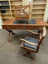 Rosewood and brass inlaid three drawer writing table on X-shaped ends, 83.5cm by 152.