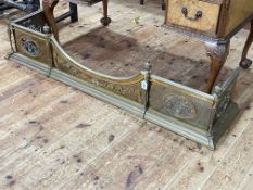 Heavy brass fender with four pierced decorative oval panels, 34cm by 153cm by 39cm.