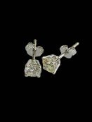 Pair of diamond stud earrings set in 18 carat white gold.