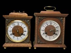 Two brass mounted wooden mantel clocks.