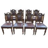 Set of eight Victorian carved walnut dining chairs in buttoned hide.
