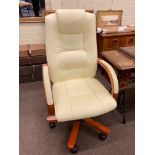 Ivory leather adjustable swivel office armchair.