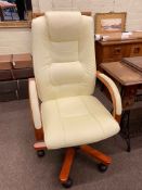 Ivory leather adjustable swivel office armchair.