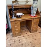 Lebus oak twin pedestal roll top desk, 117.5cm by 122cm by 68cm.