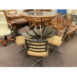 1970's circular smoked glass top dining table and four swivel dining chairs,