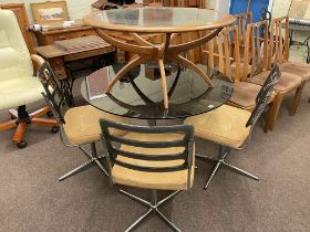 1970's circular smoked glass top dining table and four swivel dining chairs,