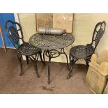 Circular painted aluminium patio table and two chairs.