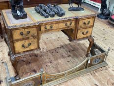 Burr walnut five drawer writing desk on ball and claw legs, 78cm by 123cm by 61cm.