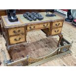 Burr walnut five drawer writing desk on ball and claw legs, 78cm by 123cm by 61cm.