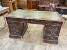 19th Century carved oak partners desk having three frieze drawers above two banks of three drawers