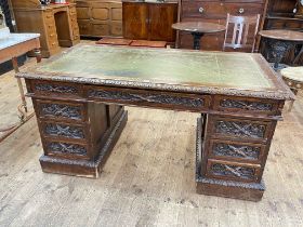 19th Century carved oak partners desk having three frieze drawers above two banks of three drawers