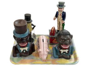 Five replica money boxes.