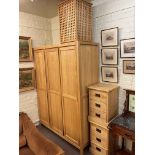 Contemporary light oak three door wardrobe, 200cm by 150cm by 57cm,