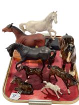 Eight Beswick horses and foals.