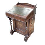 Late Victorian inlaid rosewood Davenport having concealed stationery compartments and leather