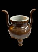 Large Chinese brown glazed two handle censor with impressed marks to rim, 29cm.