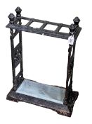 Cast iron four division stick stand, 65cm by 48cm by 23cm.