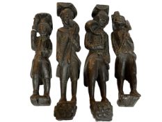 Two pairs of carved oak folk art figures including estate workers.