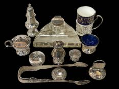 Silver condiments, menu holder, tongs, cup holder and silver mounted inkstand.