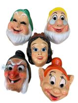 Set of five Snow White and the Seven Dwarfs face masks, circa 1970.
