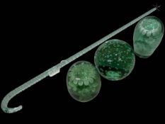 Three good 19th Century green glass dumps, two with internal flower and one with bubbles,