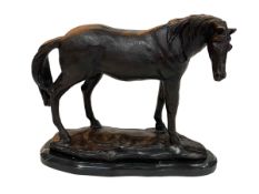 Ornate bronze horse on marble base, 23cm high.
