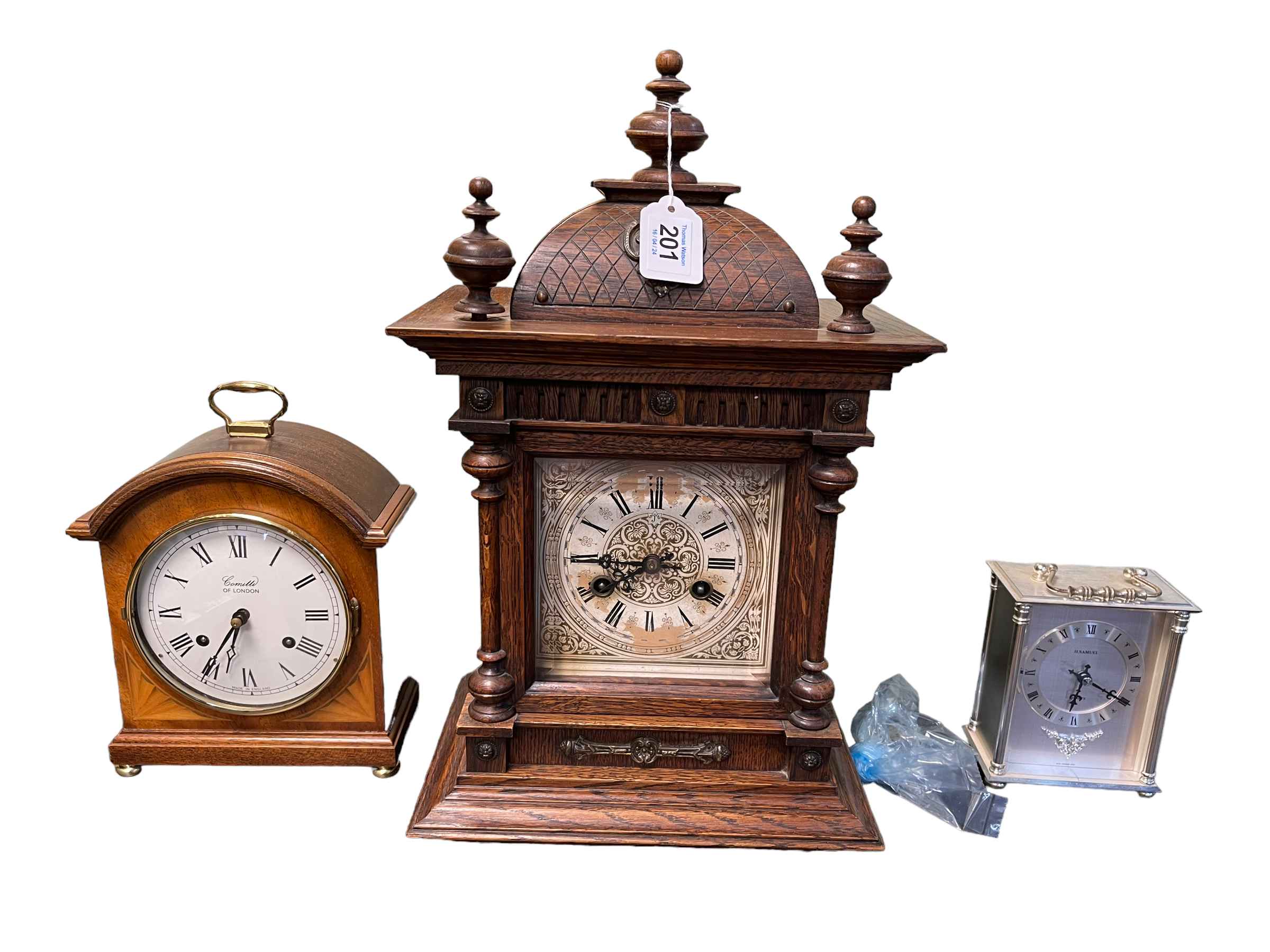 Comitti of London arch top mantel clock, oak mantel clock and quartz mantel clock.